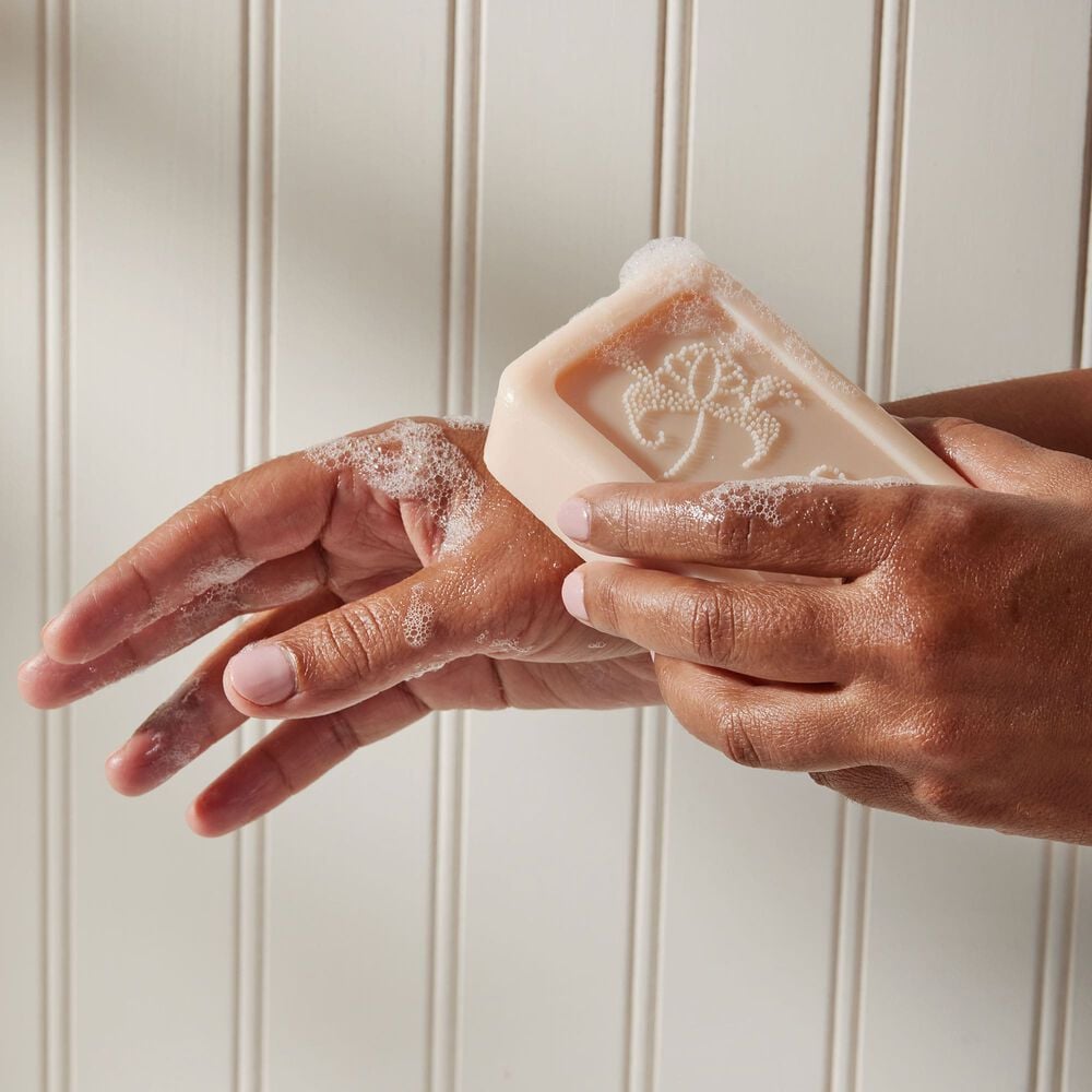 Thymes Kimono Rose Bar Soap being applied to hand image number 3